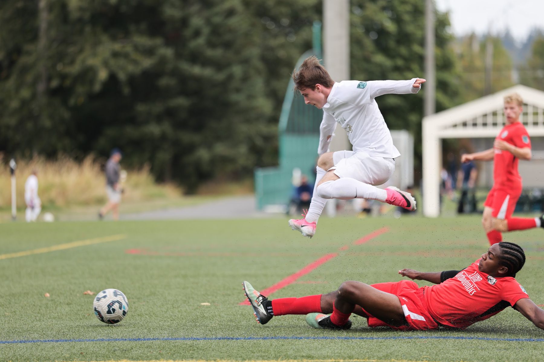 Jacob Anders making a slide tackle for Snohomish United